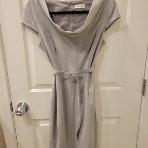 Gray cowlneck belted dress.